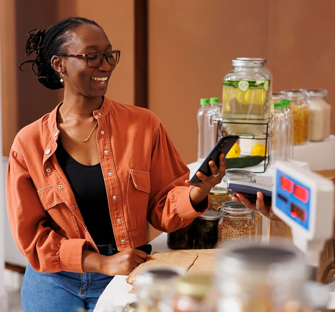 Business owner collecting customer payments